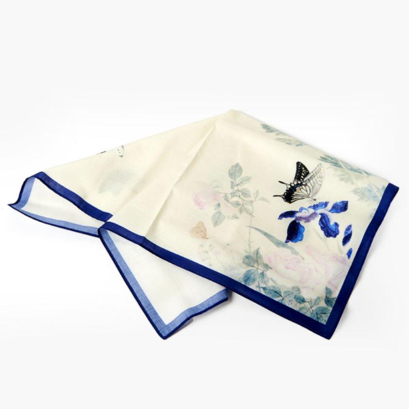 Decorative napkin with butterfly and floral design on a white background