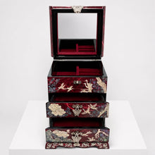 Red crane jewellery chest open, showing mirrored top compartment and velvet drawers – PEUM