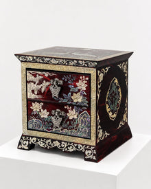 Crane jewellery chest in garnet lacquer, angled view with butterfly pulls – PEUM